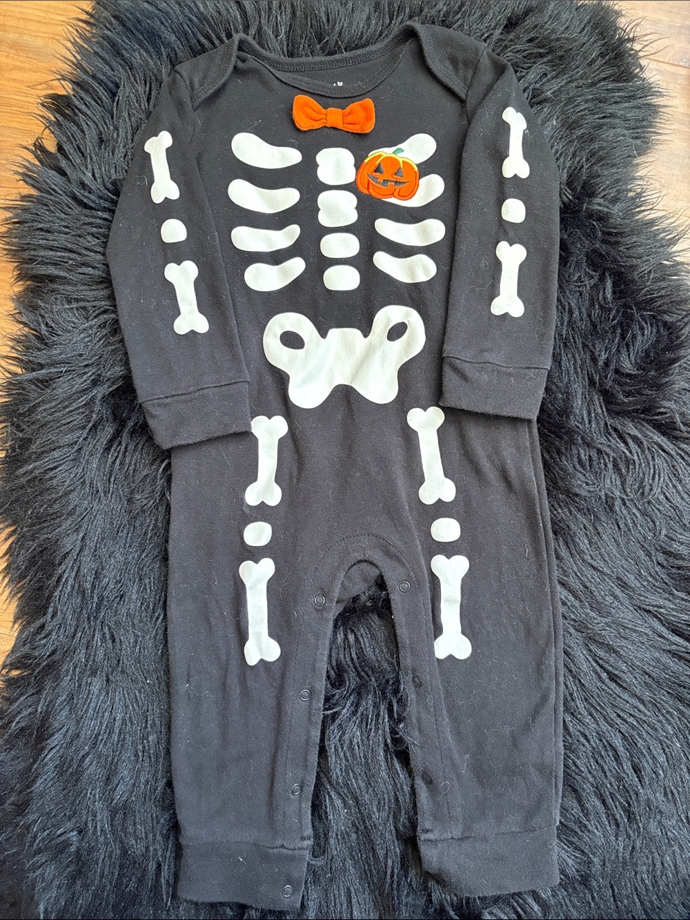 Black Glow Skeleton One-Piece with Orange Bow and Pumpkin Accent